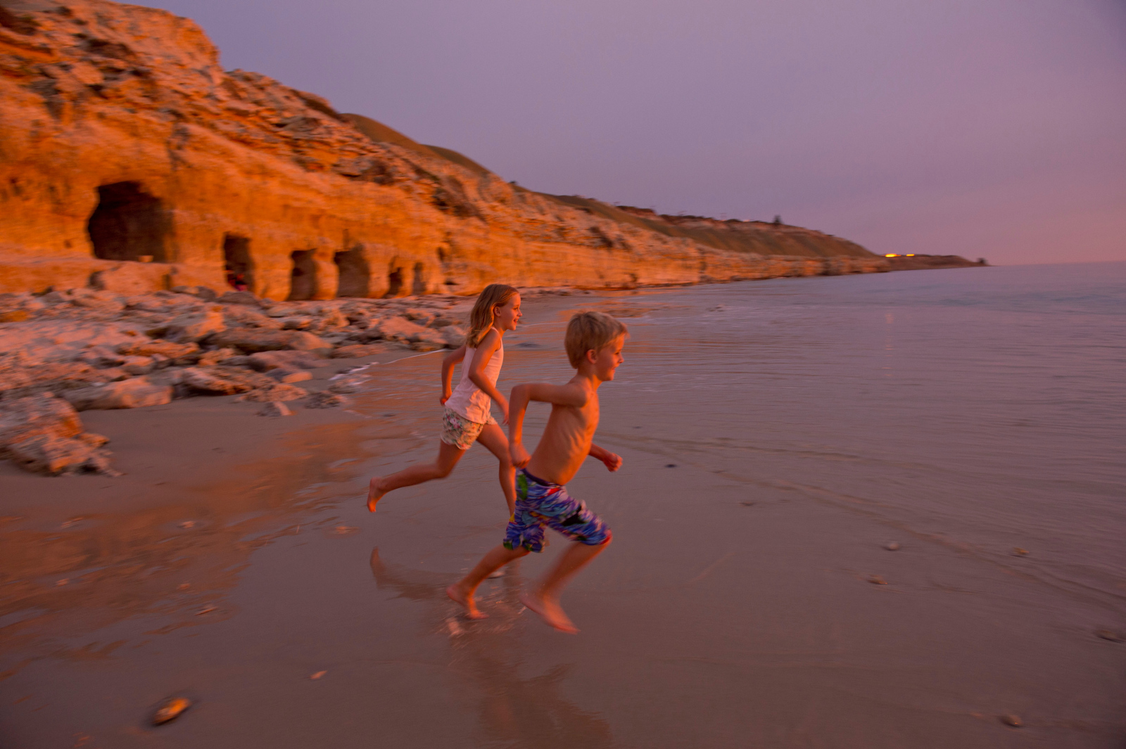 Kids running on the beach at Port Willunga 