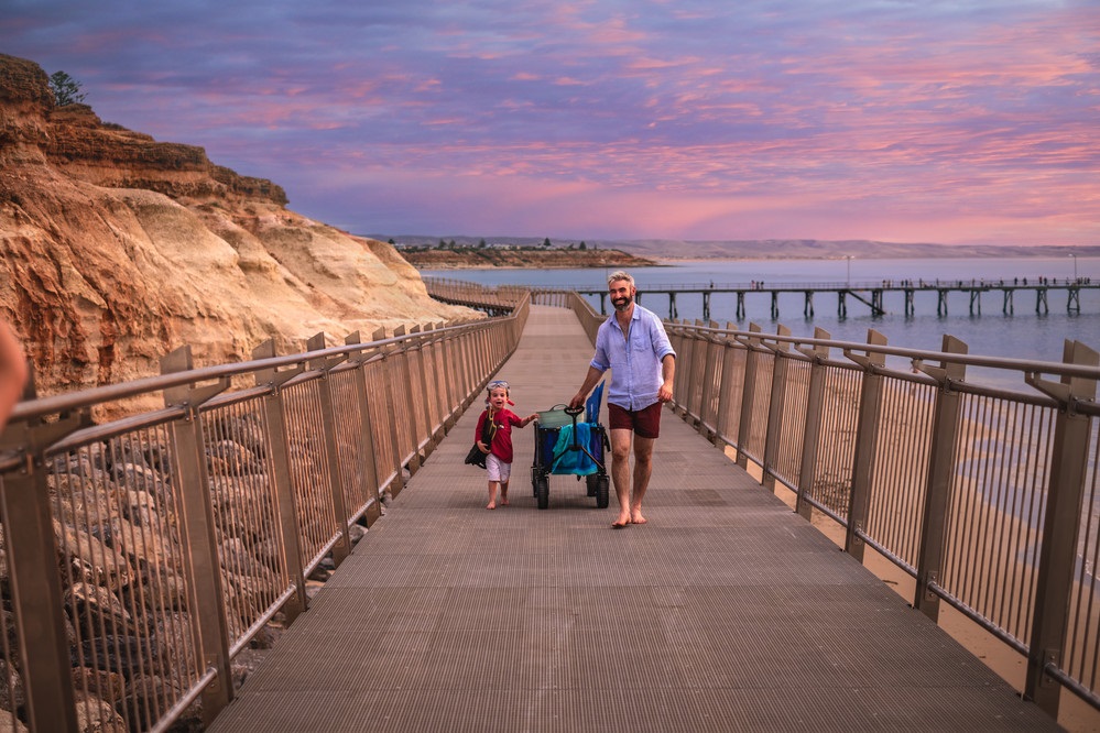 witton bluff coastal walk with a couple waling at sunset